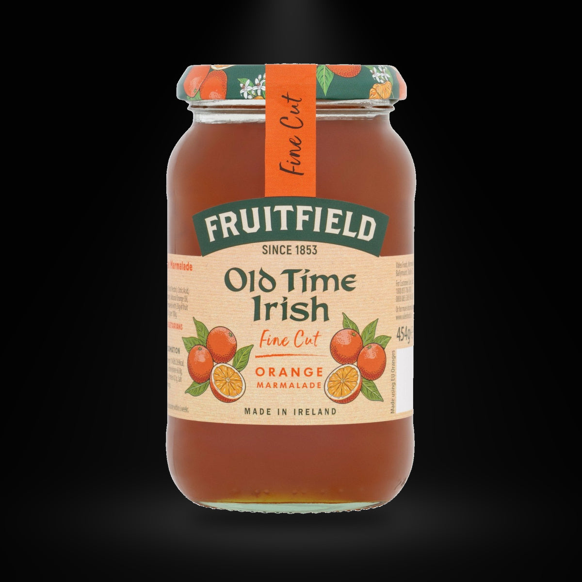 Old Time Irish Fine Cut Orange Marmalade on a black background with an overhead spotlight