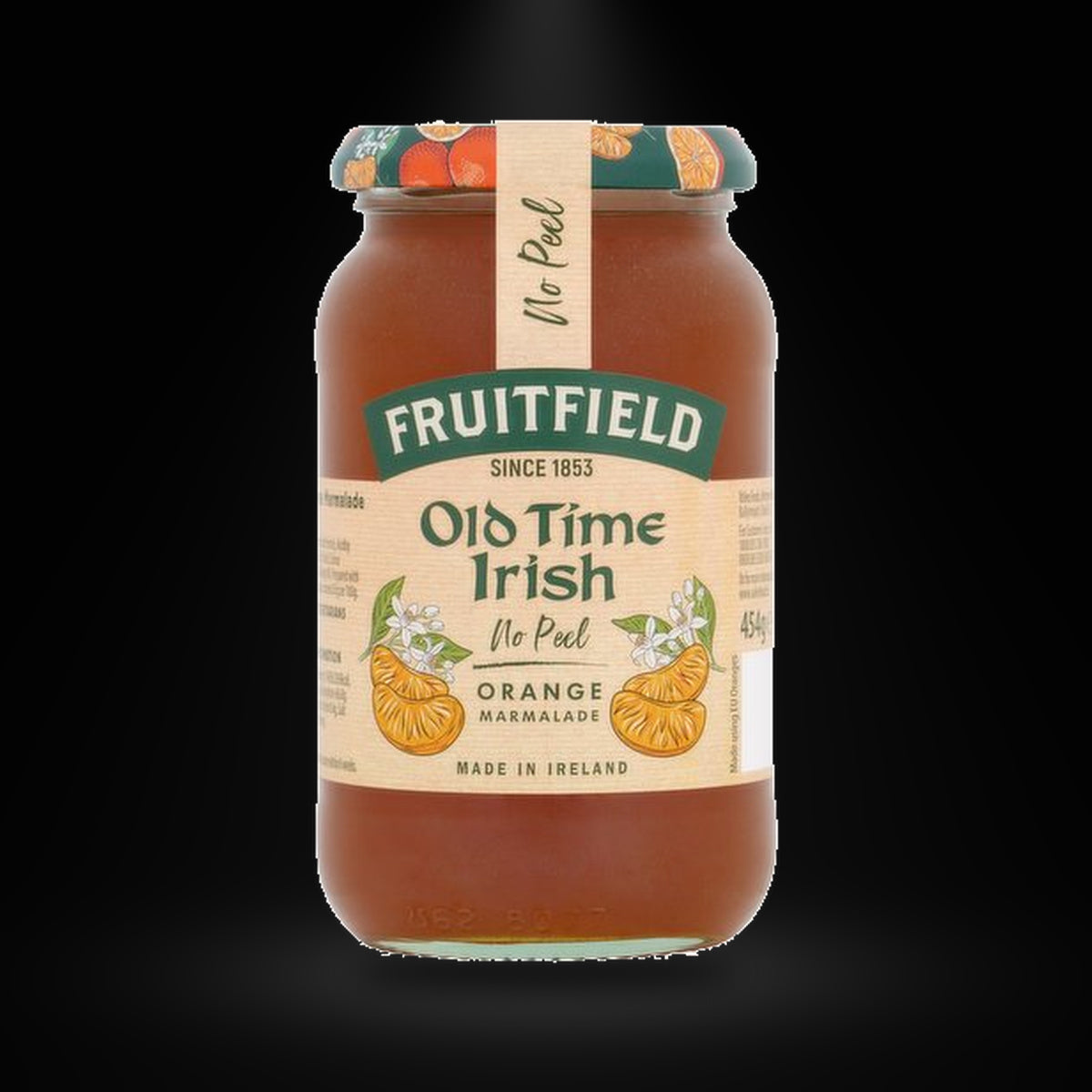 Old Time Irish No Peel Orange on a black background with an overhead spotlight