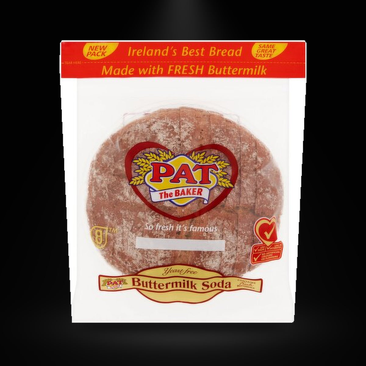 PAT buttermilk soda bread on a black background with an overhead spotlight
