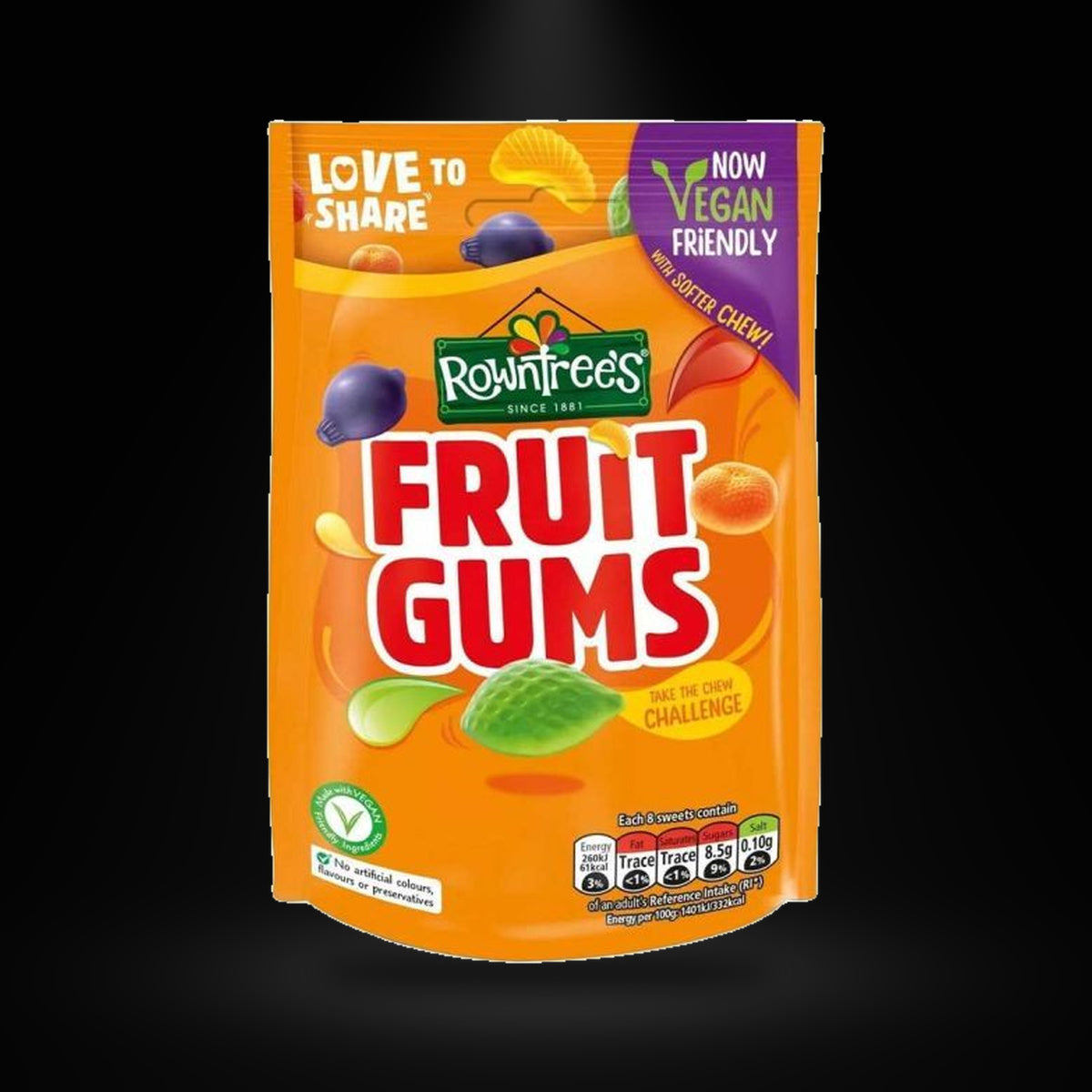 Rowntrees Fruit Gums 120gm on a black background with an overhead spotlight