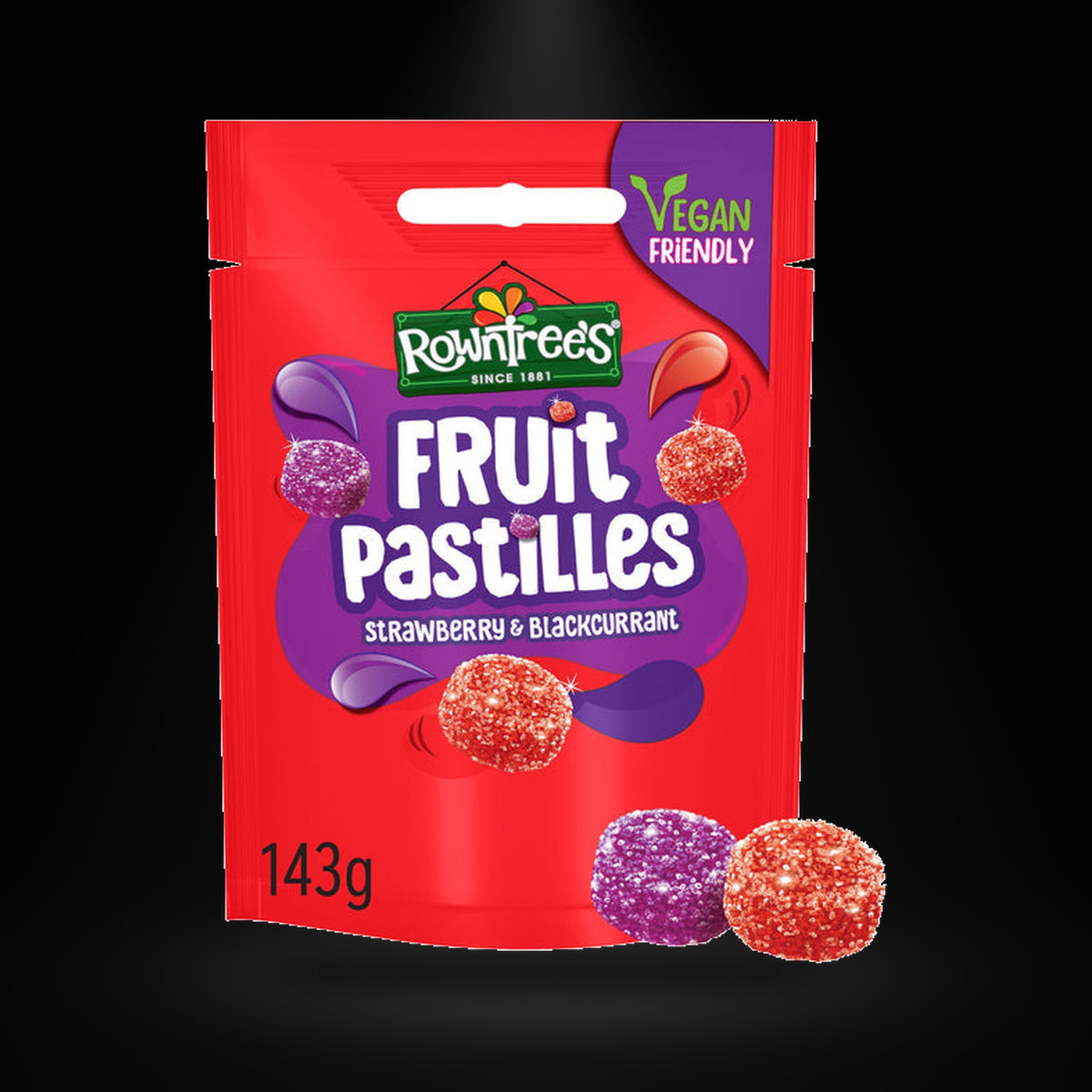 Rowntrees Fruit pastilles strawberry blackcurrant 143 gm on a black background with an overhead spotlight