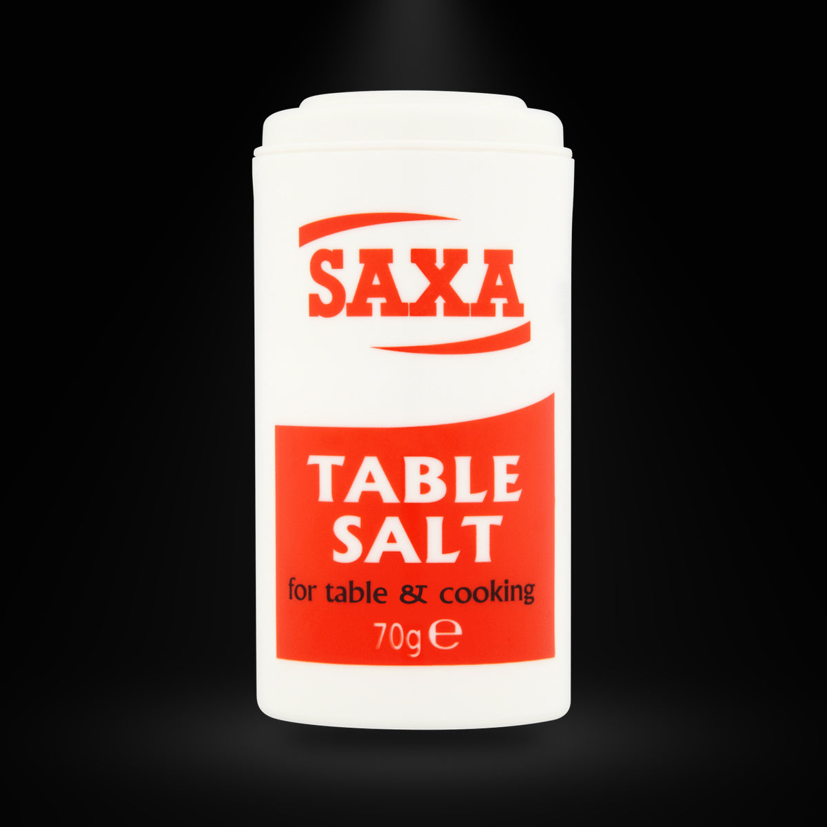 Saxa Salt Table Mini Pot 70G on a black background with an overhead spotlight