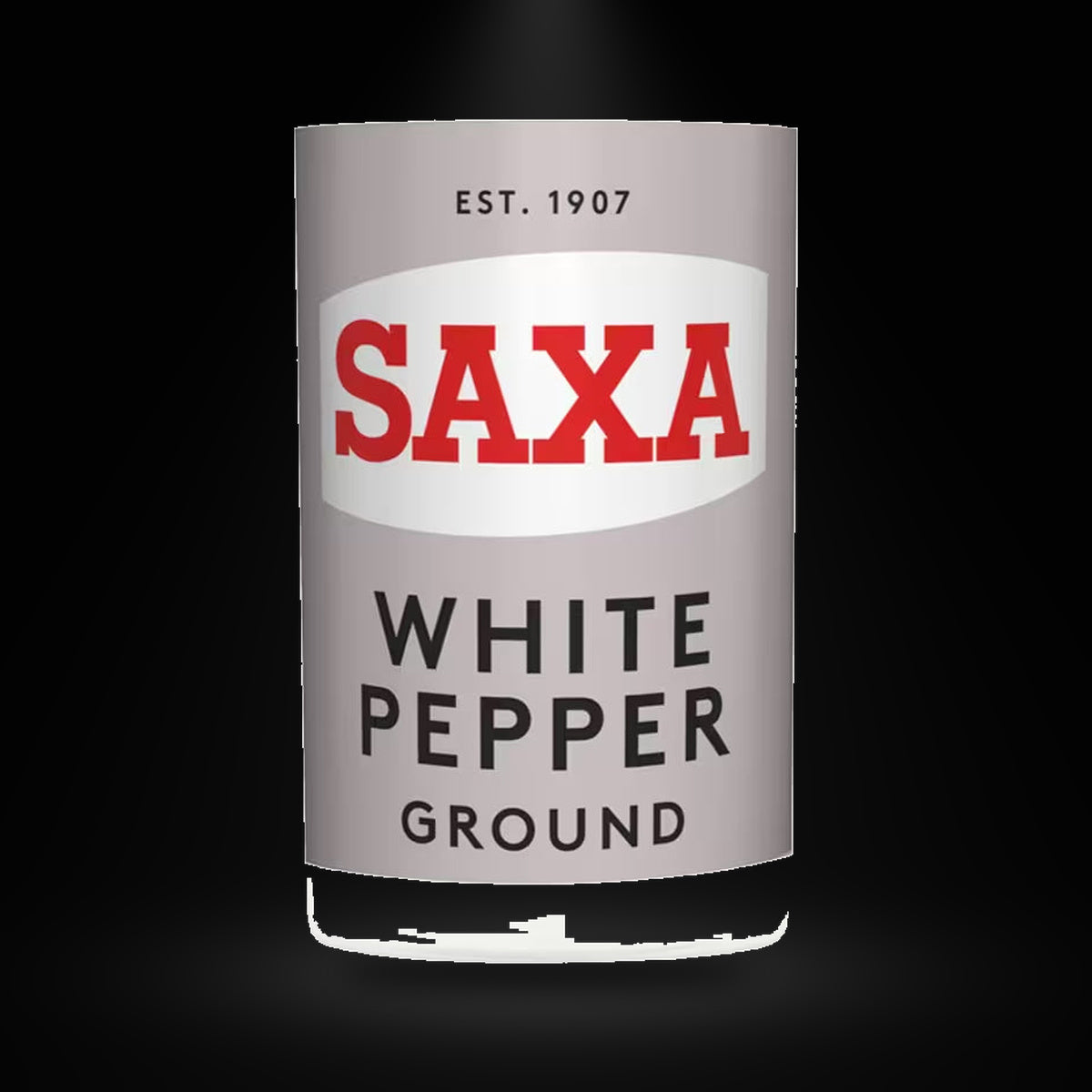 Saxa white pepper on a black background with an overhead spotlight
