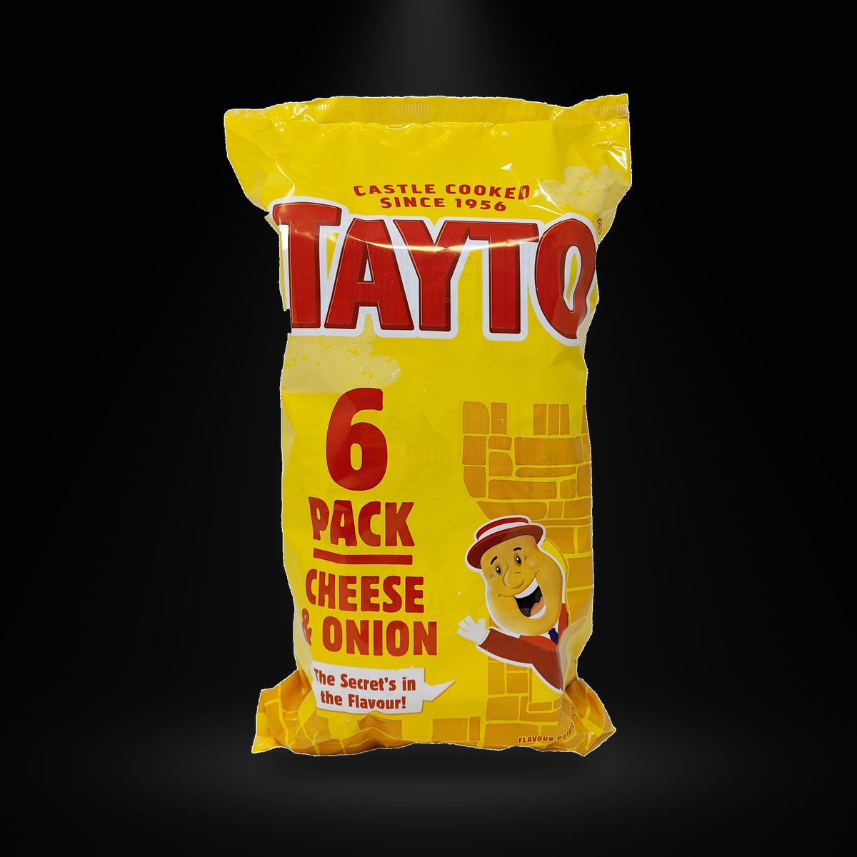 Tayto NI Cheese&Onion 32.5G on a black background with an overhead spotlight