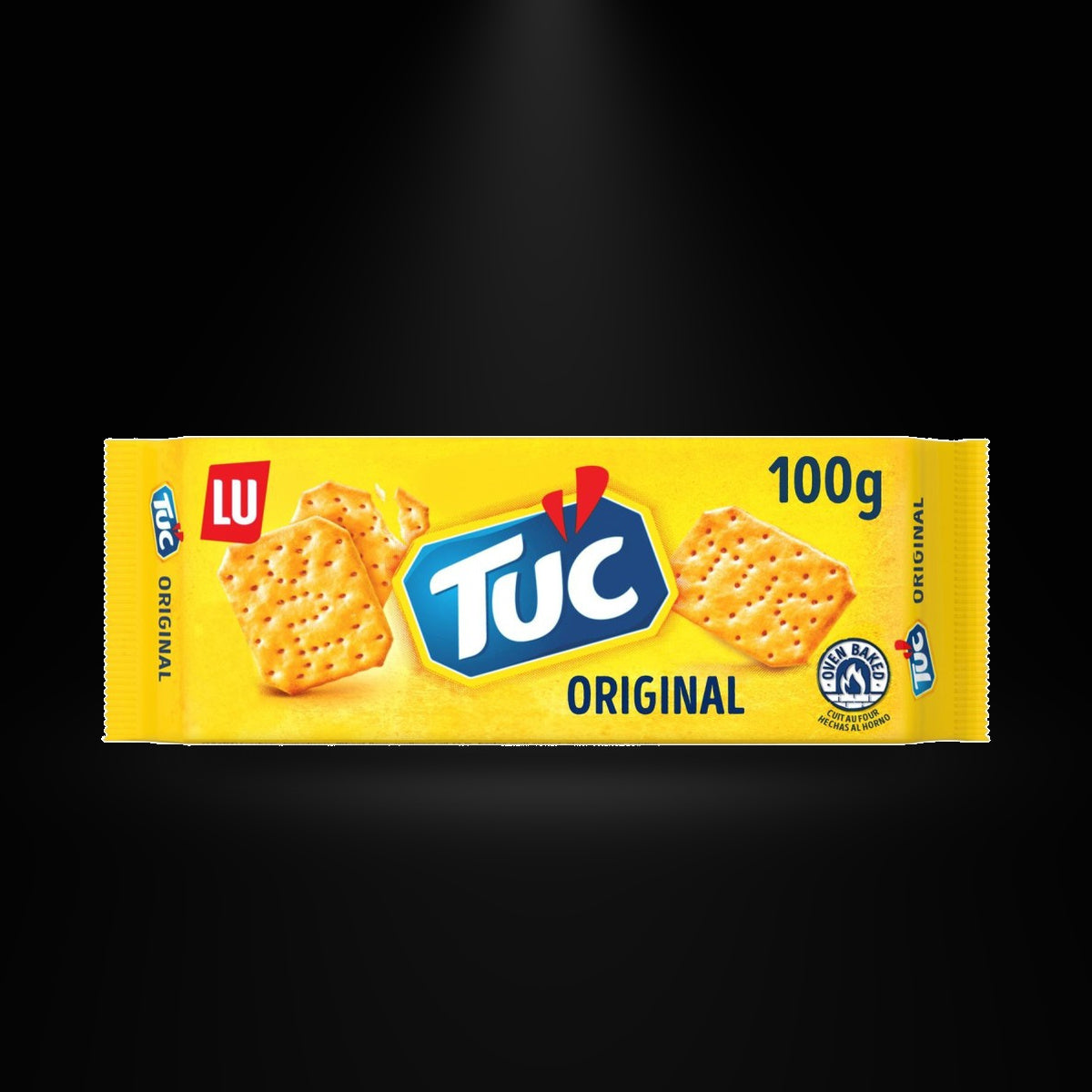 Tuc Original 100gm on a black background with an overhead spotlight